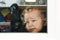 cute toddler baby boy close up portrait with flat nose agains the window