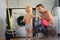 Cute toddler blond boy helps his father put the Laundry in the washing machine. Family housework, male housewife concept