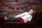 Cute toddler blond child, cute boy with valentine decoration, love, flowers, sitting on armchair with frame