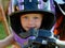 Cute toddler boy in a motorcycle helmet