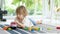 Cute toddler boy playing with lego blocks construction set on the floor at home