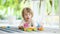 Cute toddler boy playing with lego blocks construction set on the floor at home