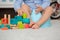 Cute toddler boy, potty training, playing with his teddy bear