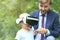 Cute toddler boy uses virtual reality glusses together with father outdoor. Future Technology Concept. Copy space