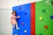 Cute toddler girl having fun in indoor leisure center for kids