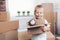 Cute toddler helping out packing boxes