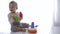 Cute toddler played educational toys pyramid in bright room