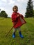 Cute toddler standing on meadow