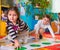 Cute toddlers playing in twister game