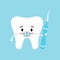 Cute tooth with dental braces and interdental brush in hand hygiene concept isolated on blue background.