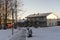 Cute townhouses near the river during sunny winter day.