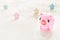 Cute toy Pink Piggy over bokeh lights and star background. Year of pig 2019. Pig symbol of year, Chinese Horoscope