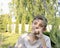 cute twelve-year-old boy in purple lavender flowers in sunlight feeling happy, having fun and showing positive and funny emotions