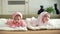 Cute twin sisters babies lying on the blanket