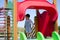 Cute two years old boy playig in the children playground outdoors on the playhouse