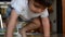 Cute two years old boy standing up from the laminate floor