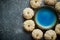 Cute white Baby boo mini pumpkins placed in circle with blue ceramic bowl in the middle