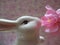 Cute white bunny rabbit figurine and artificial pink plum blossom flowers