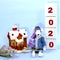 Cute white rat in a light blue suit Snow Maiden in the center of the frame near the snow-covered house and the cubes with numbers