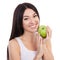 Cute woman with beautiful snow-white smile holding green apple. Healthy lifestyle and nutrition, dieting, weight loss, cosmetology