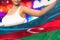 cute woman holds Azerbaijan flag in front on the party lights - flag concept 3d illustration