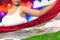 Cute woman holds Tajikistan flag in front on the party lights - flag concept 3d illustration