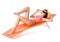 Cute woman on orange sunbed