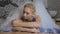 Cute woman resting under the foam in the Turkish bath