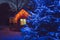Cute wood play house in home garden, decorated with Christmas LED string lights outdoors.