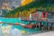 Cute wooden boathouse on the alpine lake, Dolomites, Italy, Europe