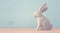 Cute wooden bunny over colorful background.