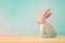 Cute wooden bunny over colorful background.