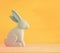 Cute wooden bunny over colorful background.