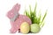 Cute wooden Easter bunny, grass and dyed eggs