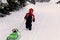 Cute year-old girl playing in the snow