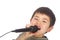 Cute young asian boy singing into a microphone
