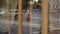 Cute young blonde woman in red dress crossing road in reflection
