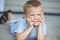 Cute Young Boy On Porch