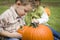 Cute Young Children Playing At the Pumpkin Patch