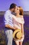 Cute young couple in love in a field of lavender flowers. Enjoy a moment of happiness and love in a lavender field. kiss