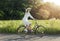 Cute Young Cyclist Girl on Rural Road