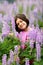 Cute Young Girl in Patch of Purple Wild Flowers