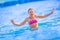 Cute young girl playing in the sea. Happy pre-teen girl enjoys summer water and holidays in holiday destinations