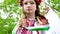 cute young girl teenager ukrainian woman in folk traditional develops her curls beautiful wreath with many flowers