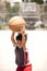 Cute young kid holding basketball