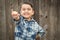 Cute Young Mixed Race Boy Making Shaka Hand Gesture