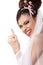 Cute young playful bride showing wedding ring and makes faces