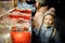 Cute young sisters choosing sweets on traditional Christmas market in Riga, Latvia. Kids buying candy and cookies on Xmas