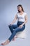 Cute Young Woman: Fashion Portrait in Blue Jeans and Bare Feet