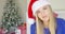 Cute young woman with Santa Claus hat